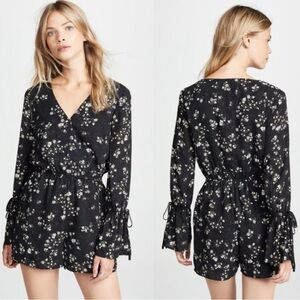 Cupcakes & Cashmere Black and White Floral Romper with Bell Sleeves